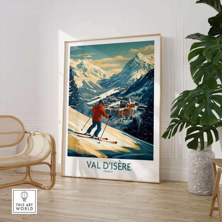 Vintage-style Val-d'Isère ski poster wall art displayed in a modern room with plants and a wicker chair.