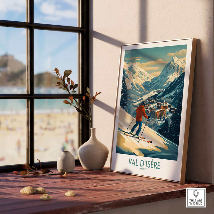 Val-d'Isère ski poster wall art on wooden shelf, featuring a skier descending a snowy slope with mountain scenery in the background.