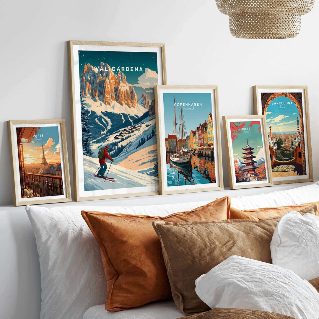 Val Gardena Ski Poster on display among framed travel posters on a shelf, showcasing Italy's scenic mountains.