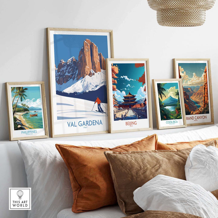 Modern living room with a collection of framed wall art posters, featuring a Val Gardena ski scene highlighted in the center.