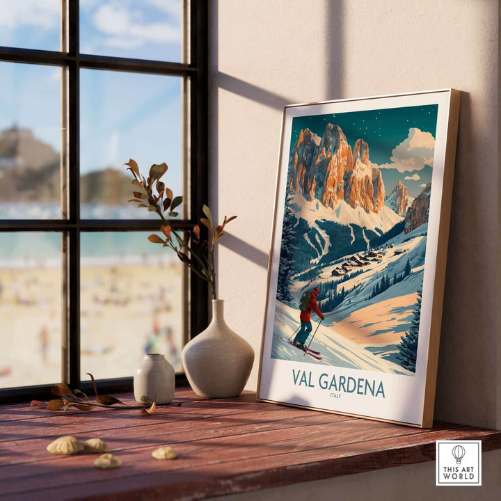 Val Gardena Ski Poster on windowsill with mountain scene depicting skier in Italy, vibrant wall art print.