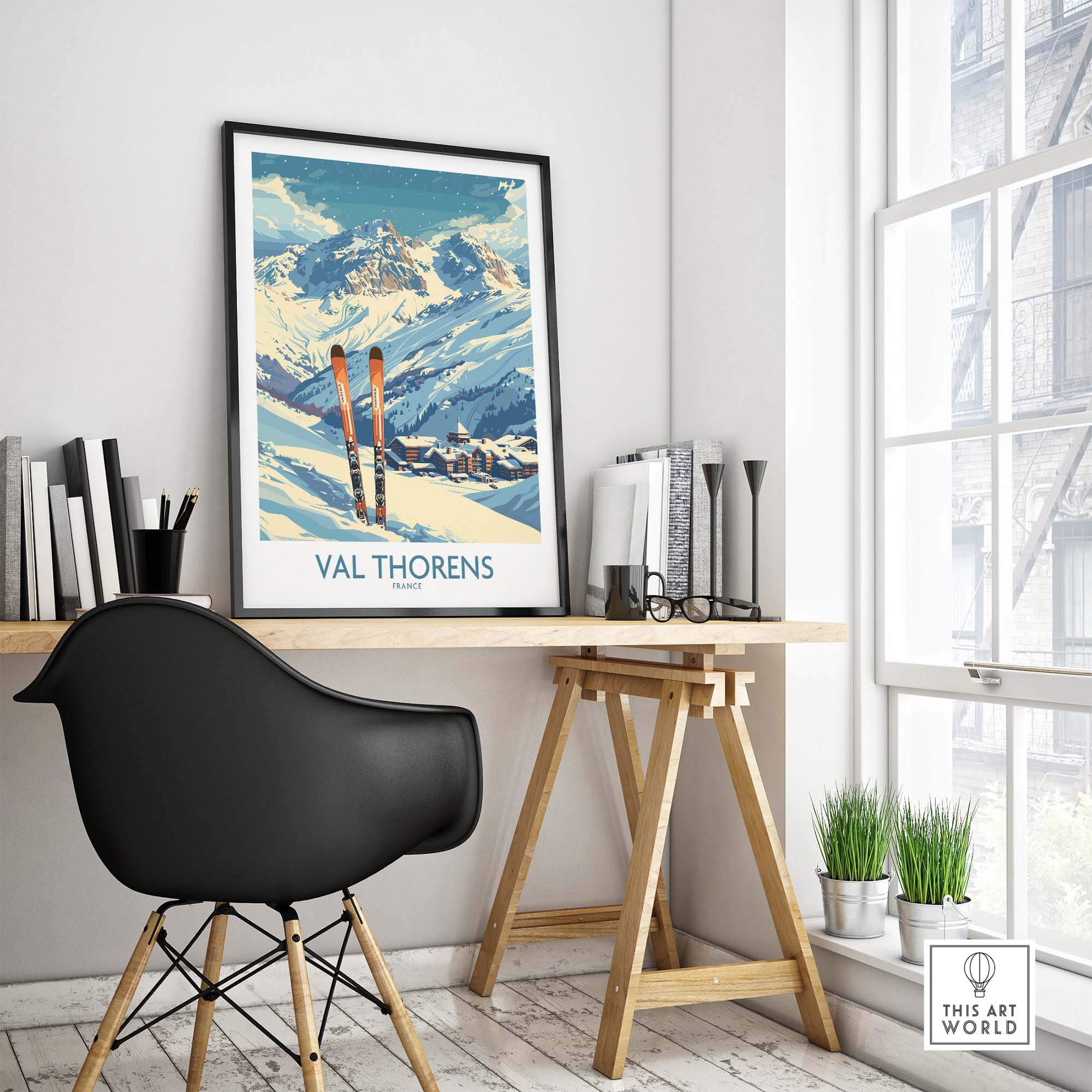 Val Thorens print displayed in a stylish home office, featuring ski equipment and beautiful mountain scenery.
