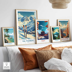 Framed Val Thorens print among travel-themed artwork, showcasing snow-capped mountains and skiing allure.