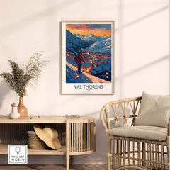 Val Thorens ski print framed on a wall in a cozy room with a chair and decorative plants, showcasing a beautiful snowy landscape.