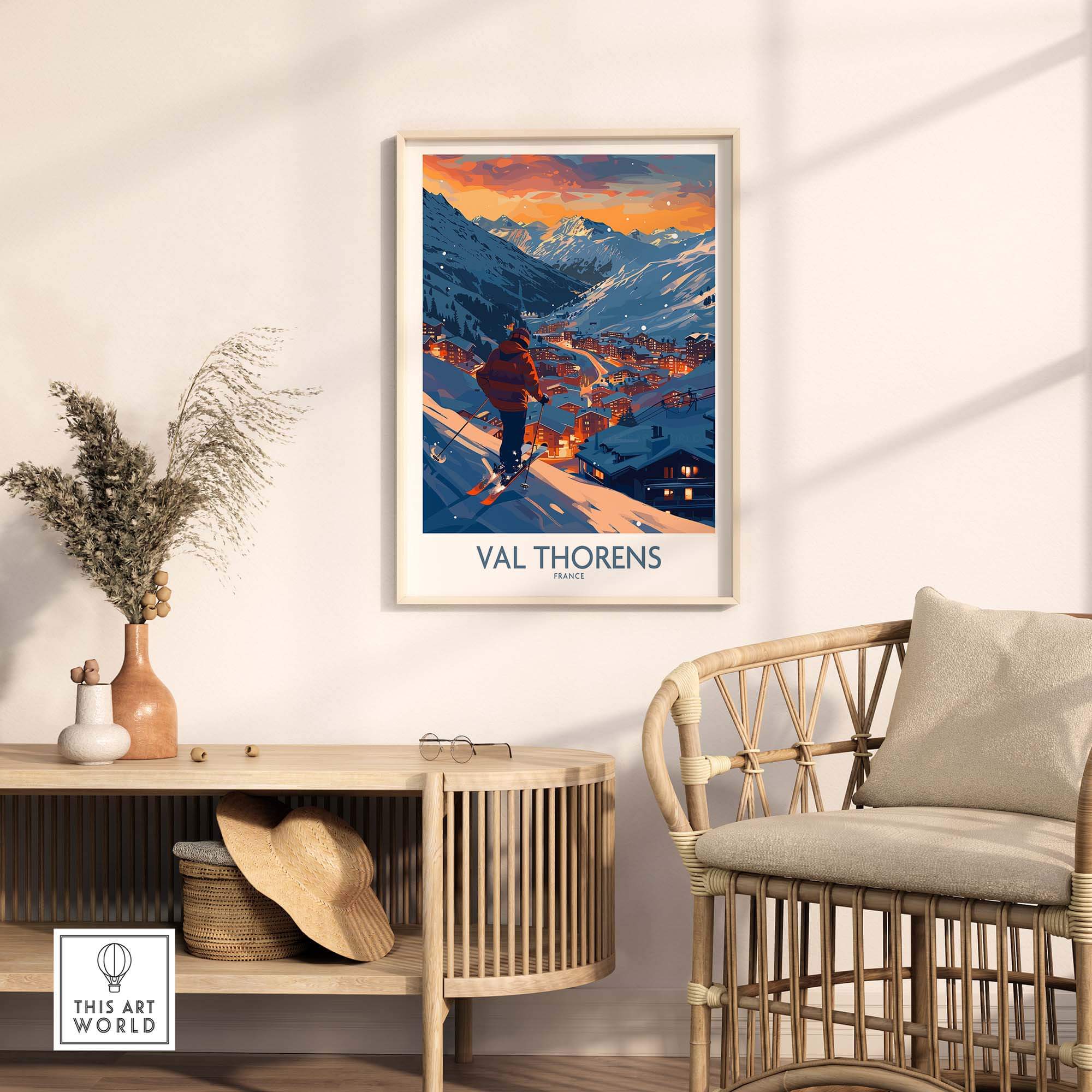 Val Thorens ski print framed on a wall in a cozy room with a chair and decorative plants, showcasing a beautiful snowy landscape.