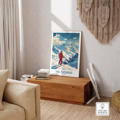 Val Thorens skiing poster displayed in a cozy living room, capturing the stunning snow-covered slopes of the French Alps.