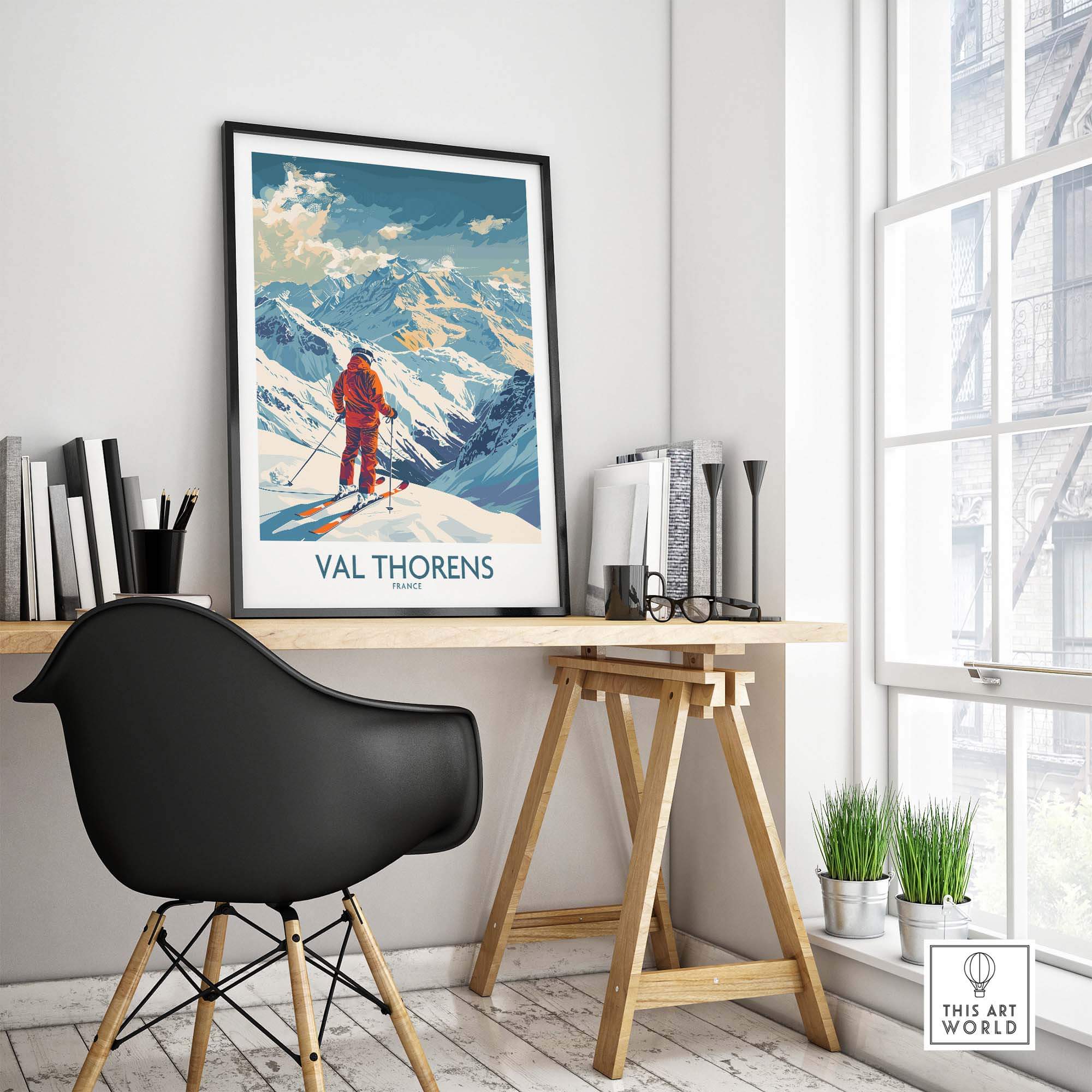 Val Thorens skiing poster displayed in a modern room with a stylish desk and chair, showcasing winter landscape art.