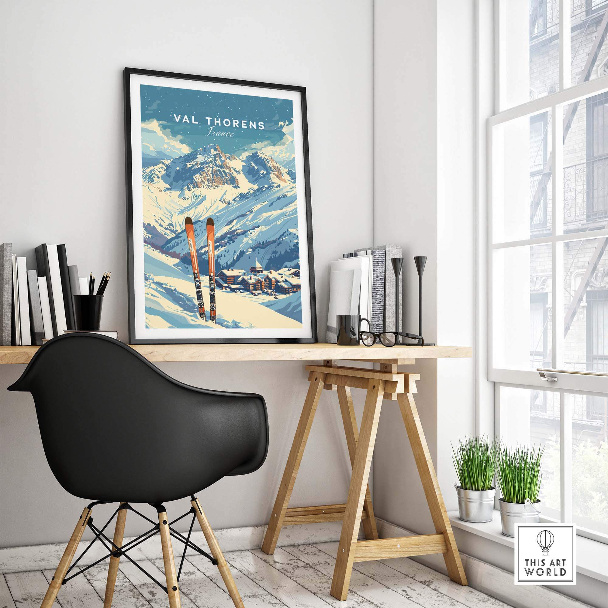 Val Thorens travel poster displayed in a stylish home office with skis, showcasing picturesque alpine views.