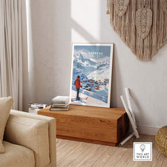 Val Thorens wall art print featured in a cozy interior, showcasing snowy mountains and a skier, perfect for home decor.