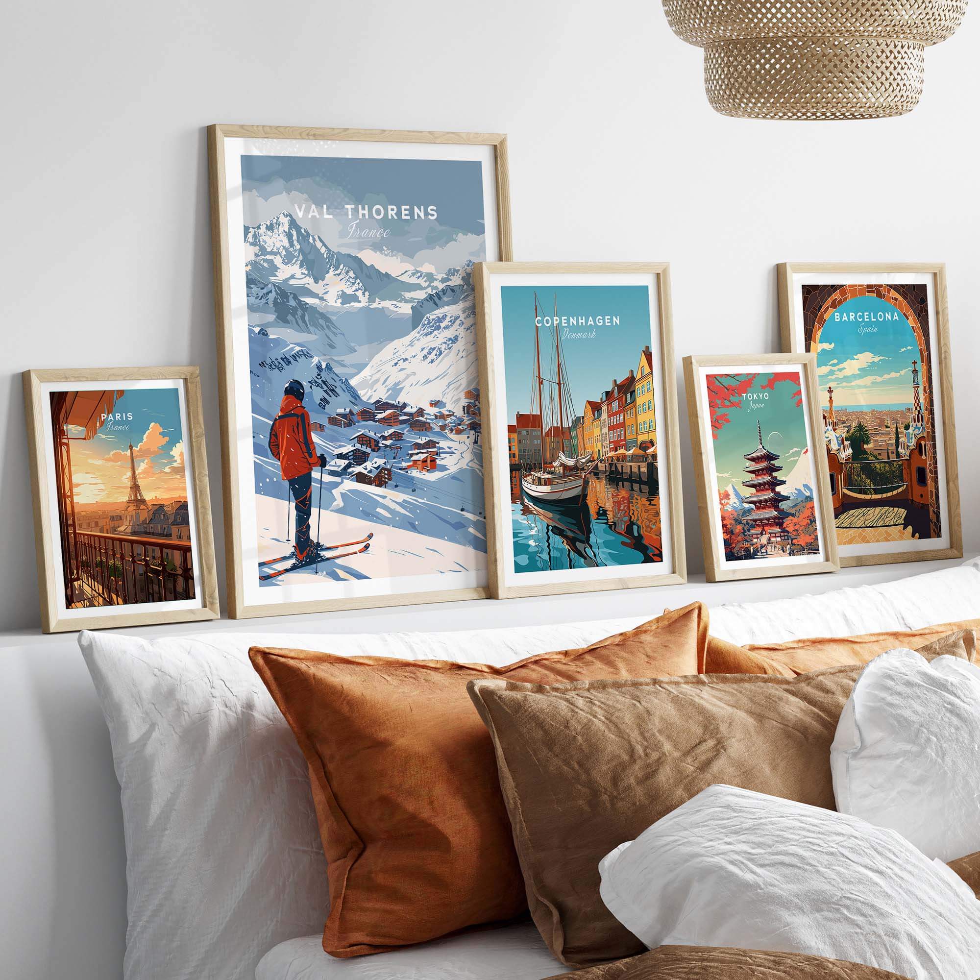 Val Thorens Wall Art Print among framed travel posters in a cozy living room setting, showcasing a ski theme and adventure.