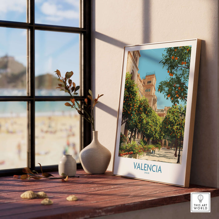 Framed Valencia Old Town wall art featuring vibrant greenery and architecture beside a beach view, ideal travel decor.