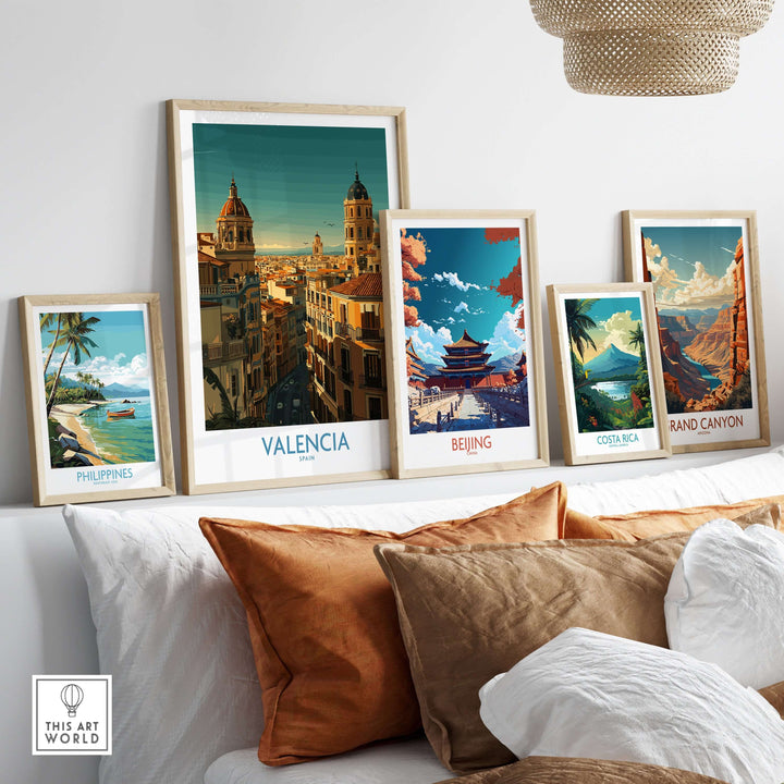 Colorful travel posters featuring Valencia, Beijing, Costa Rica, and the Philippines displayed in a modern living room.