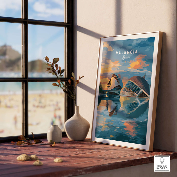 Valencia travel poster on a windowsill, showcasing Ciudad de las Artes y las Ciencias with a beach view.