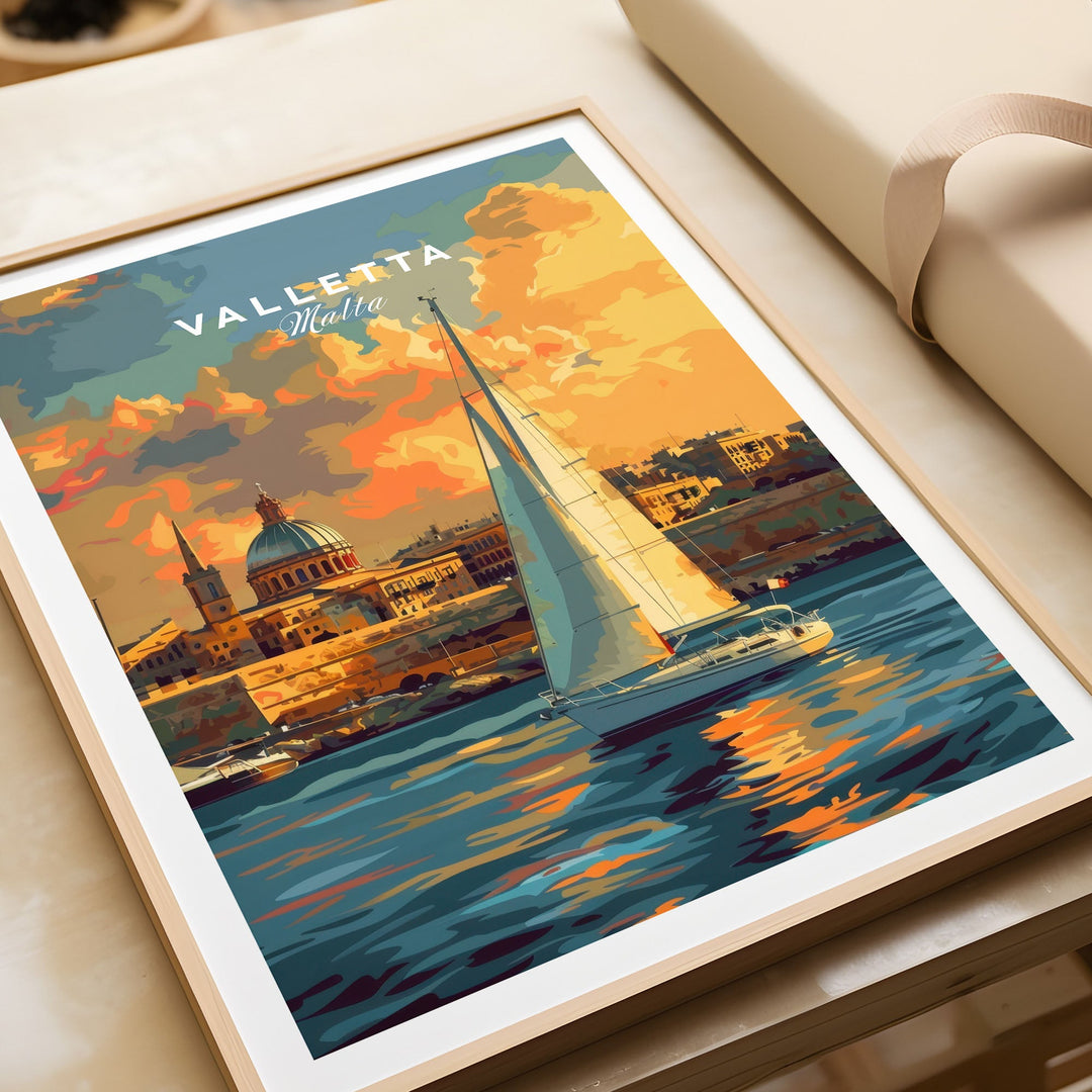 Valletta Malta wall art print featuring a sailboat on the water with vibrant sunset colors and historic architecture in the background.