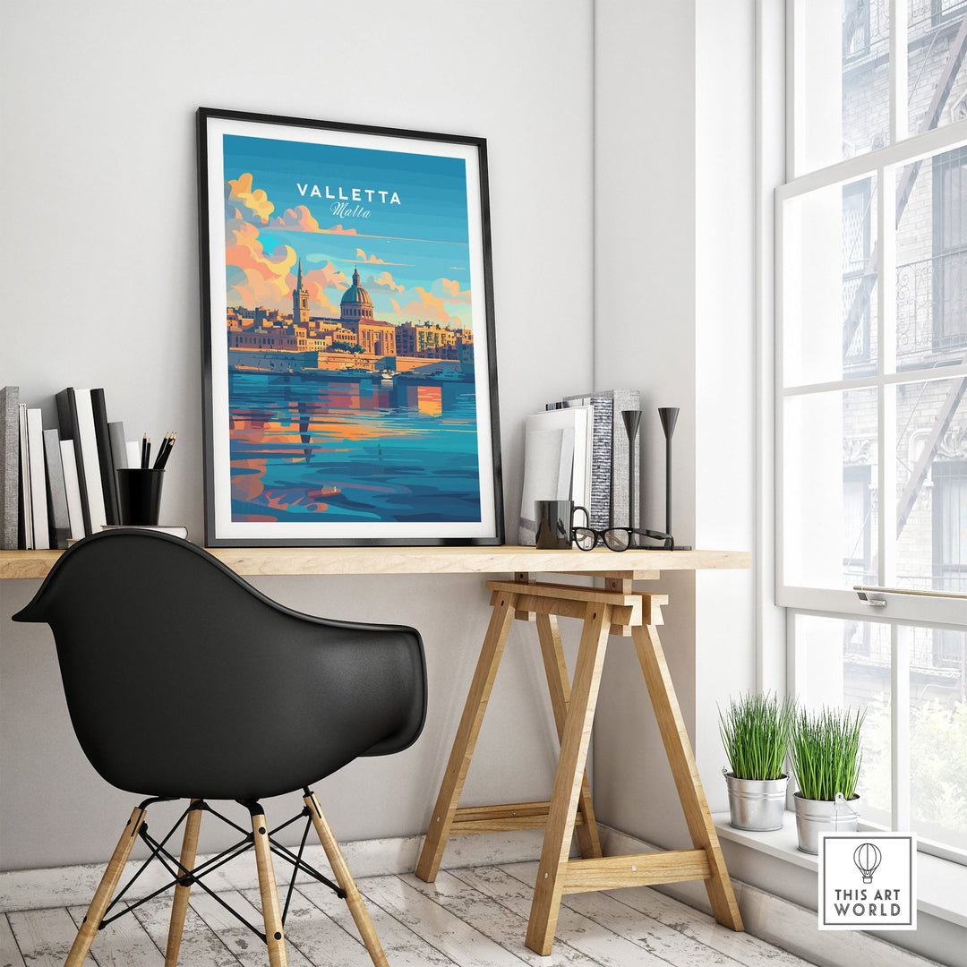 Framed Valletta, Malta poster on modern desk with black chair, showcasing vibrant cityscape and decor in bright room.