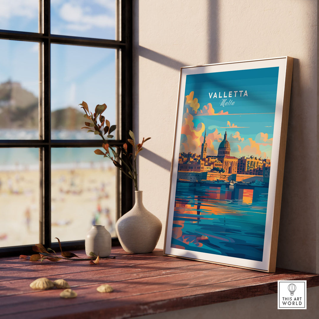 Valletta Malta poster with vibrant colors on a wooden table by a window, showcasing the historic city's beauty and charm.