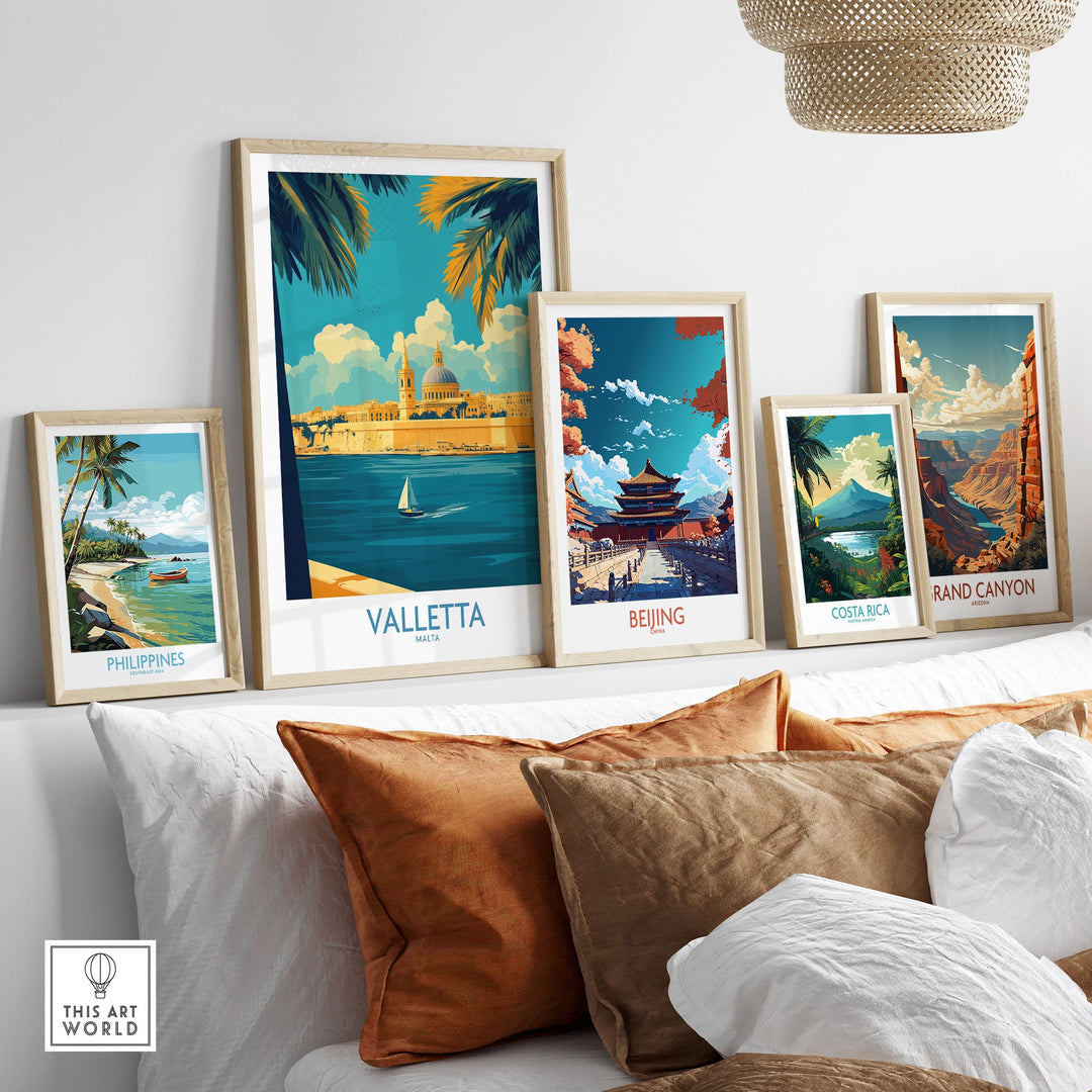 Framed travel posters of Valletta, Beijing, Costa Rica, Philippines, and Grand Canyon displayed on a wall above a sofa.