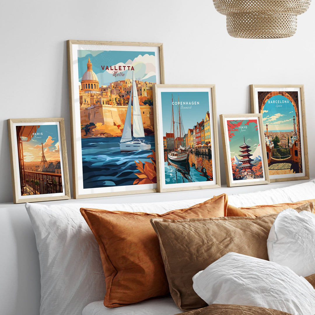 Valletta travel poster among framed wall art prints of global cities displayed above a bed.