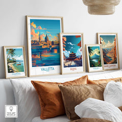 Valletta Wall Art Poster among travel-themed prints on a cozy couch, showcasing Malta's beauty and vibrant colors.