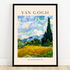 Framed Van Gogh Wheat Field with Cypresses art print poster on a wooden floor