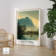 Vang Vieng Canvas Print | Misty Mountain Laos Poster displayed in a modern interior with a plant and chair.