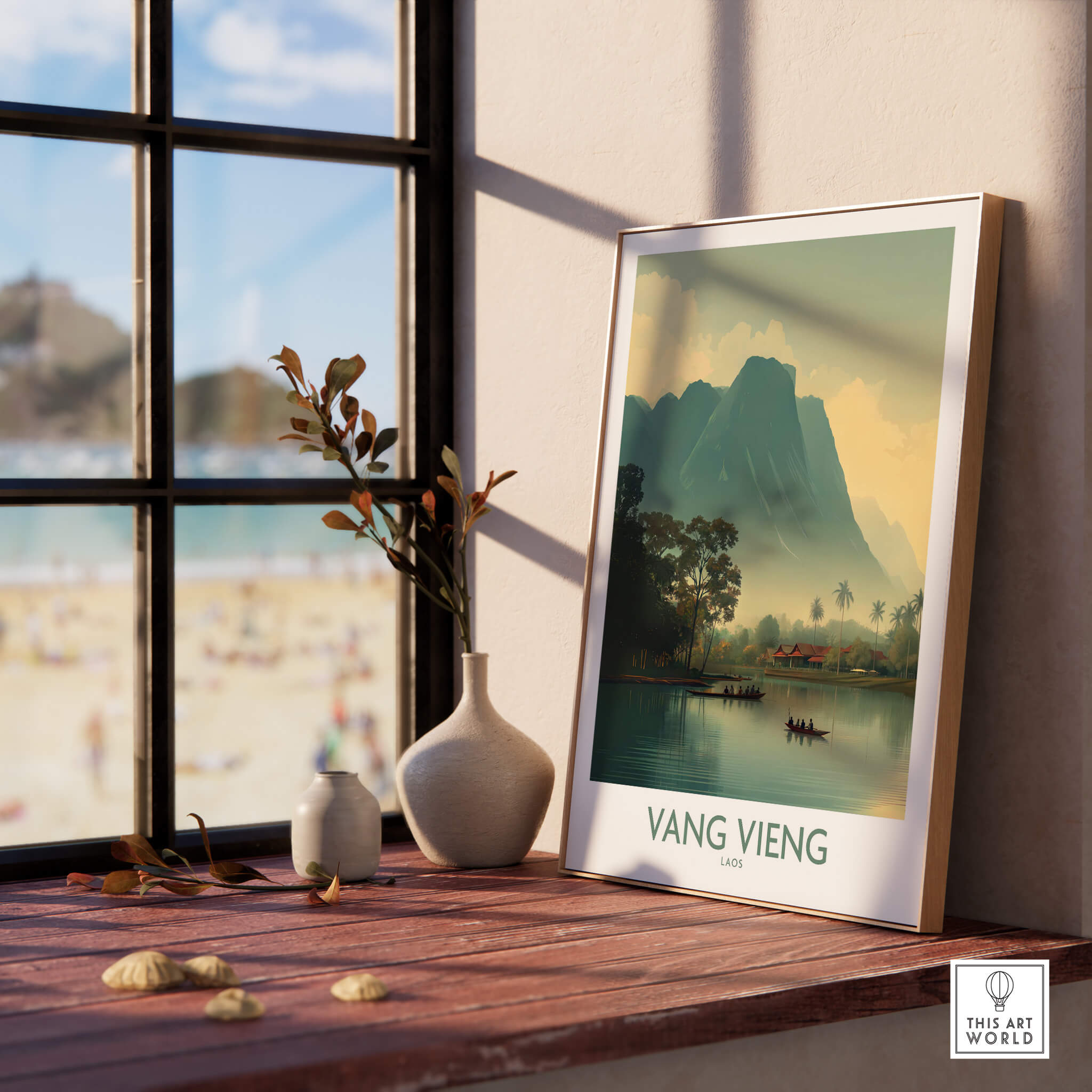 Vang Vieng Canvas Print | Misty Mountain Laos Poster displayed in a cozy interior setting with a view of the beach.