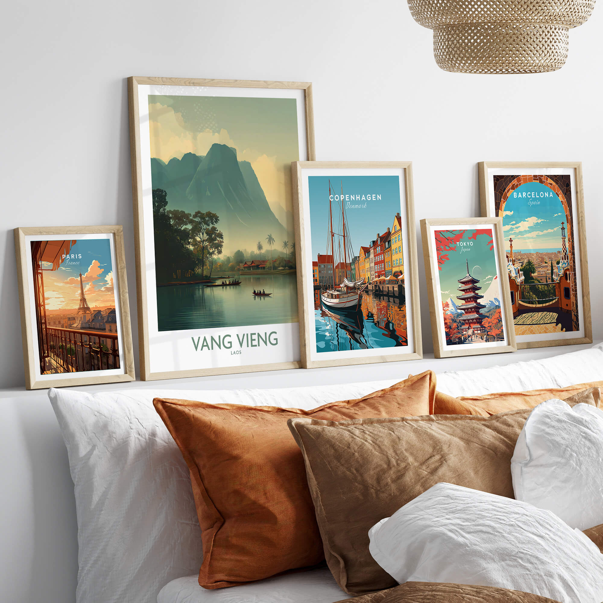 Vang Vieng Canvas Print | Misty Mountain Laos Poster displayed among other city posters on a stylish bed.
