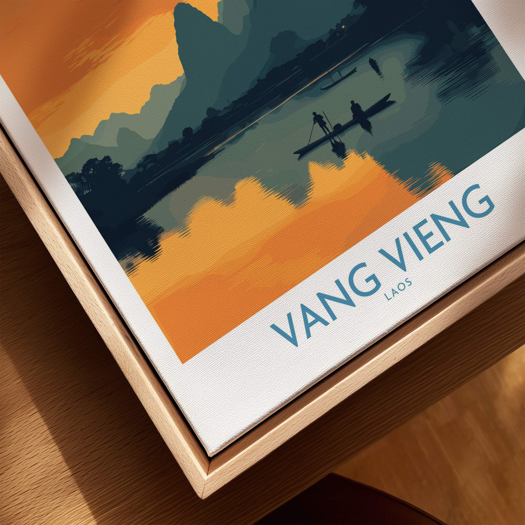 Vang Vieng Laos Canvas Print | Limestone Karst Mountain Landscape Poster on a wooden surface.