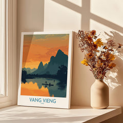 Vang Vieng Laos Canvas Print | Limestone Karst Mountain Landscape Poster displayed in a sunlit room with flowers.