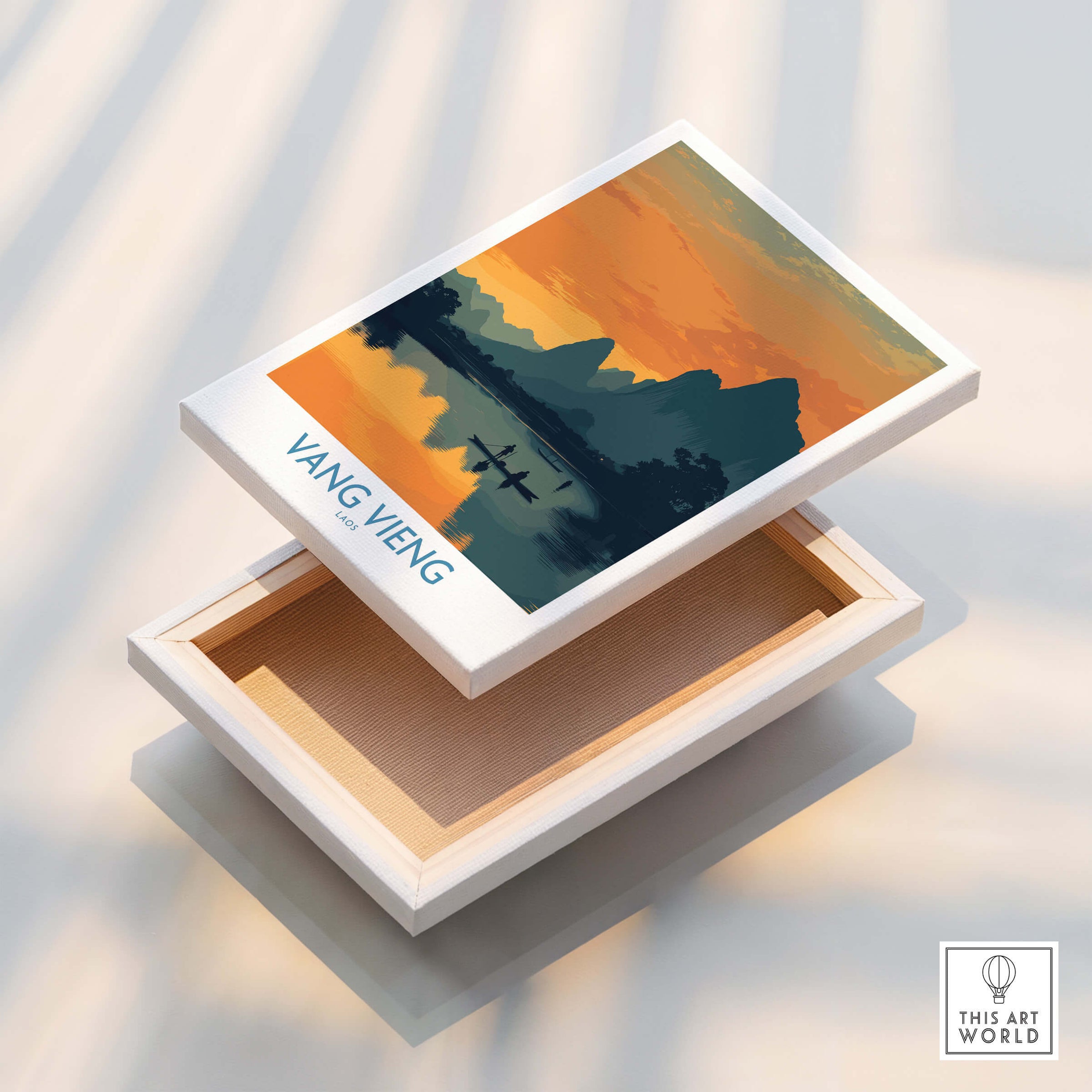 Vang Vieng Laos Canvas Print | Limestone Karst Mountain Landscape Poster displayed on a box with sunset colors.