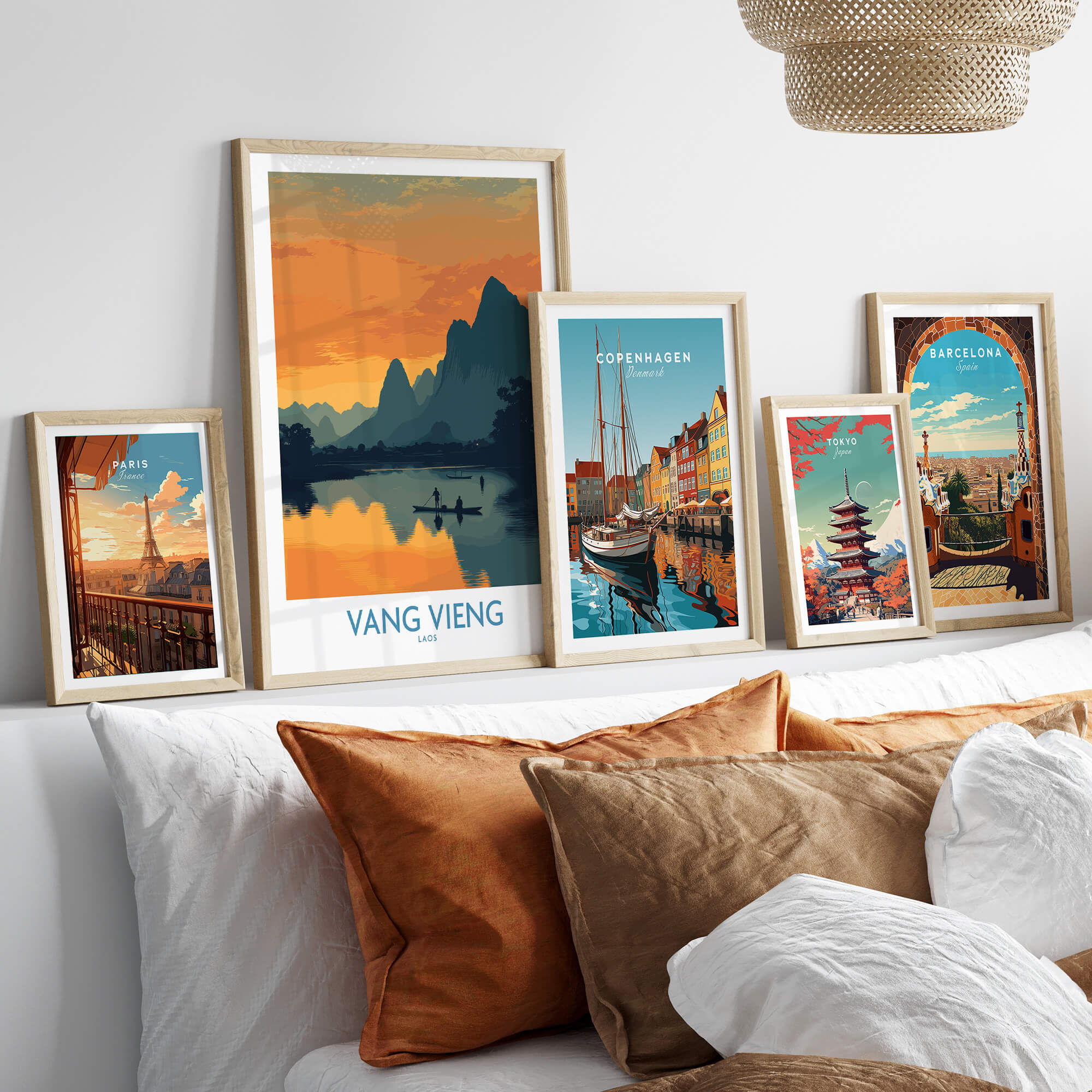 Vang Vieng Laos Canvas Print | Limestone Karst Mountain Landscape Poster displayed among framed artwork on a couch.