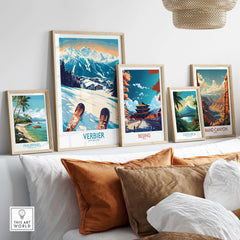 Framed travel posters including Verbier, Philippines, Beijing, Costa Rica, and Grand Canyon displayed in a cozy living room setting.