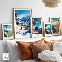 Collection of travel posters featuring Verbier ski scene, Beijing, Costa Rica, Philippines, and Grand Canyon on a stylish shelf.