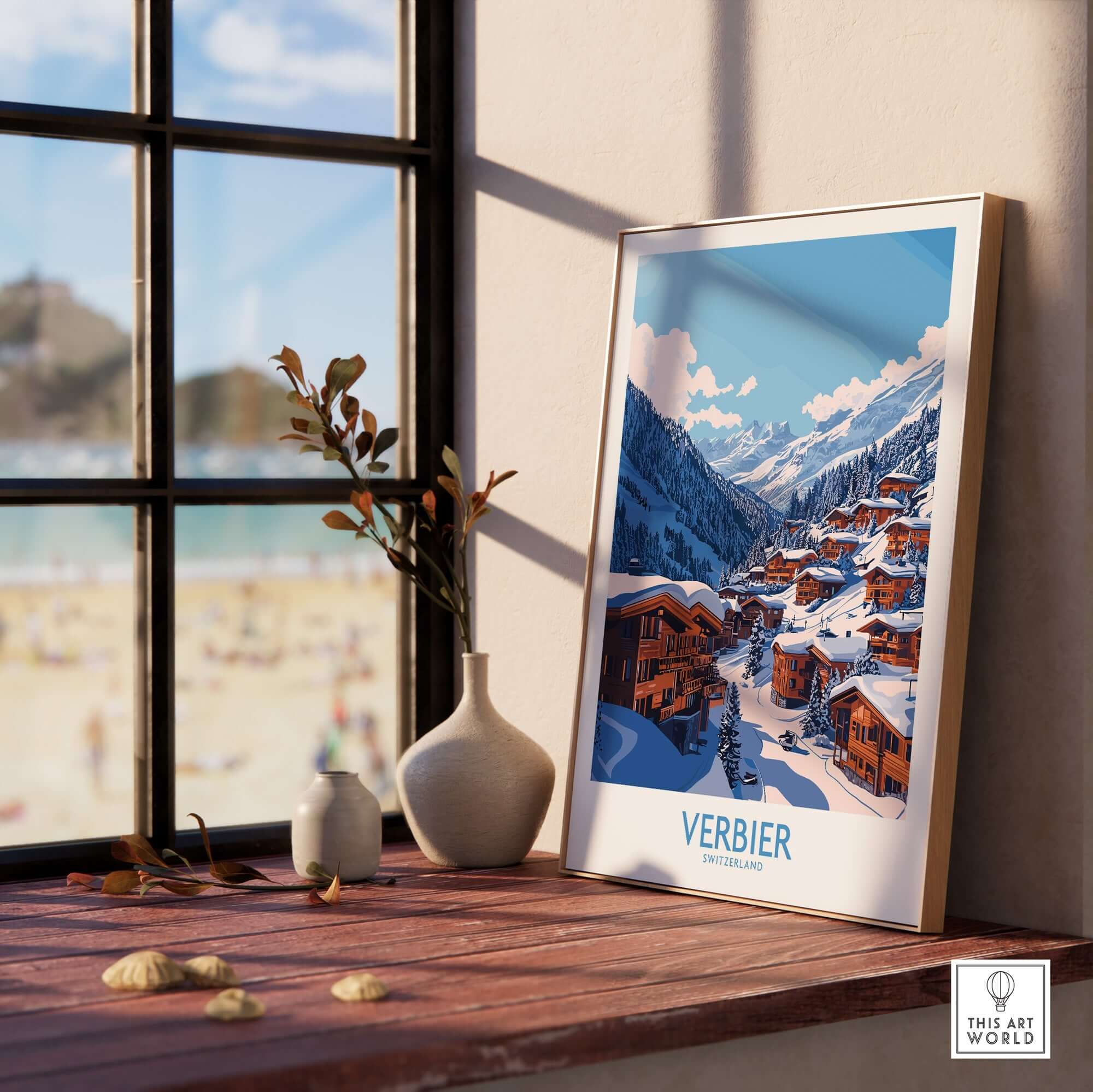 Verbier travel poster displayed on a windowsill, showcasing the iconic Swiss ski resort amidst a scenic background.