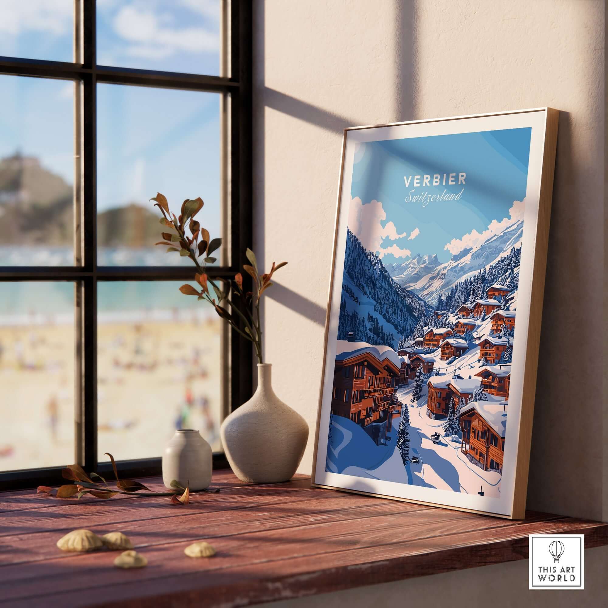 Verbier Travel Print displayed on a windowsill, showcasing a scenic winter landscape of Verbier, Switzerland. Perfect for ski enthusiasts.