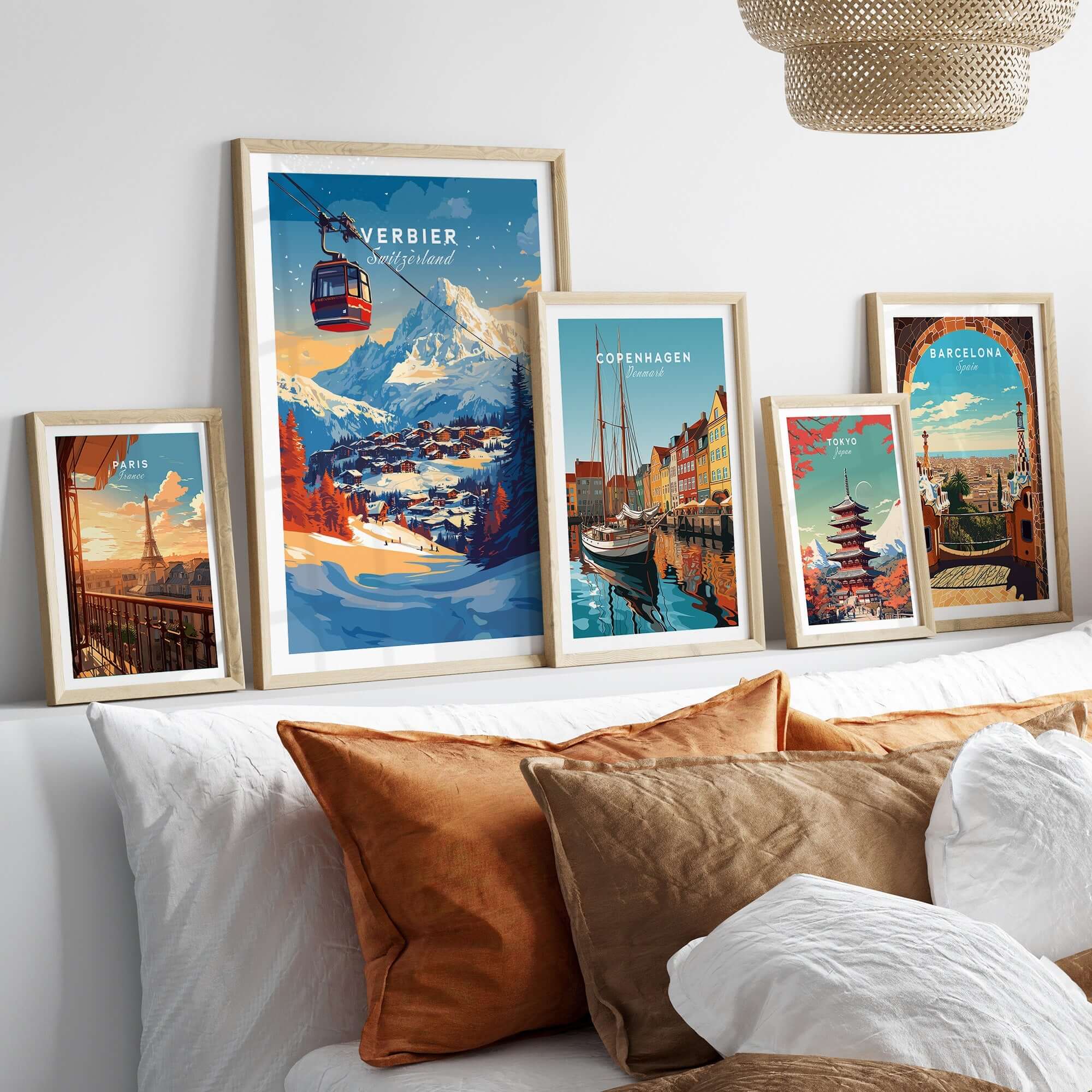 Verbier Wall Art collection featuring ski and city prints in stylish frames on a decorative bed.