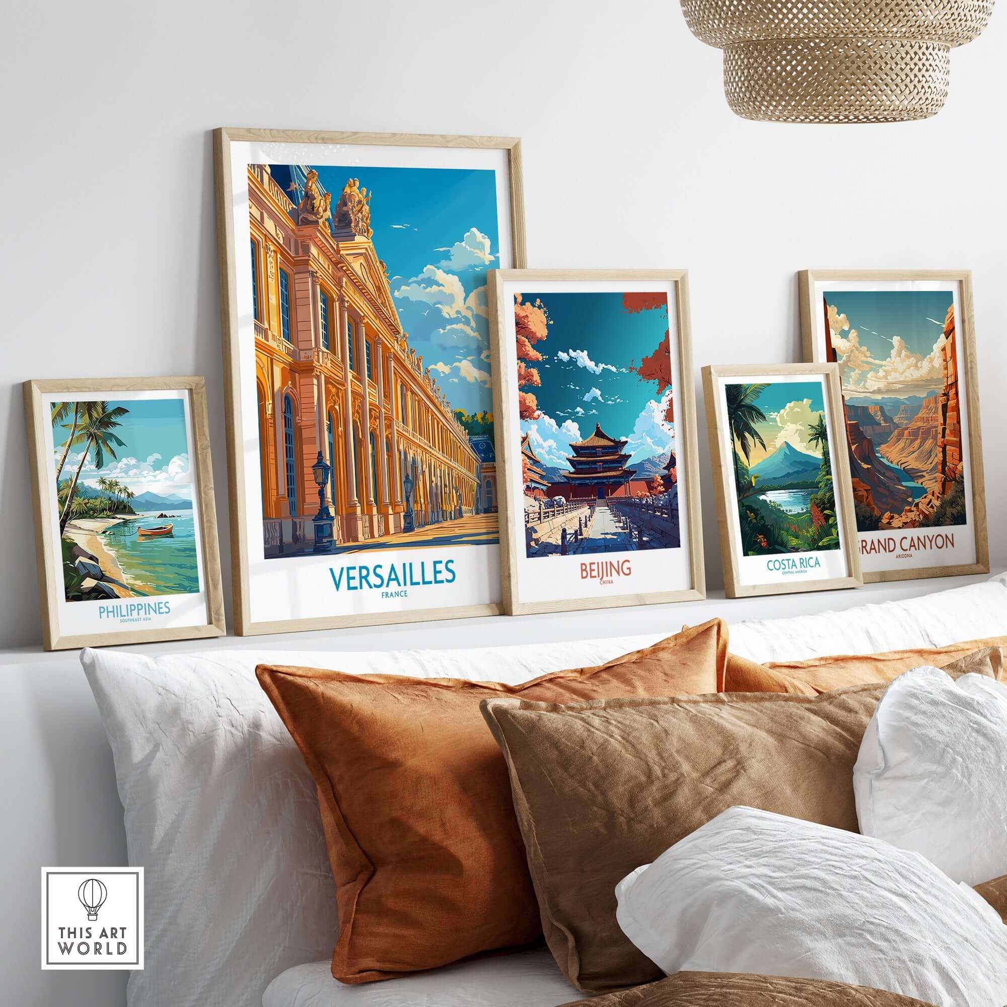 Versailles Wall Art Print displayed among travel-inspired artwork on a stylish sofa, enhancing home decor.