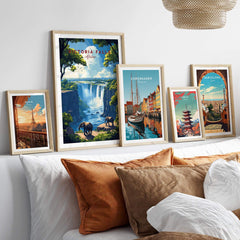 Victoria Falls Travel Print displayed among other travel posters on a stylish home decor wall.