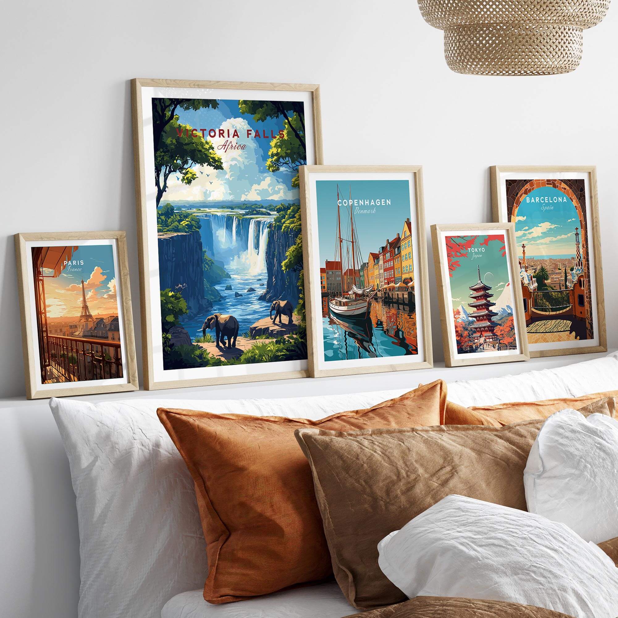 Victoria Falls Travel Print displayed among other travel posters on a stylish home decor wall.