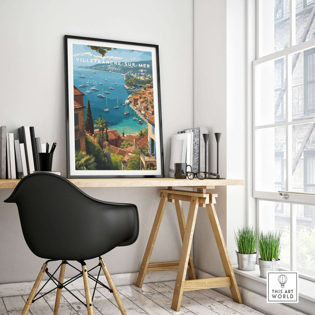 Villefranche-sur-Mer travel poster in modern workspace, showcasing scenic Mediterranean coastal views.