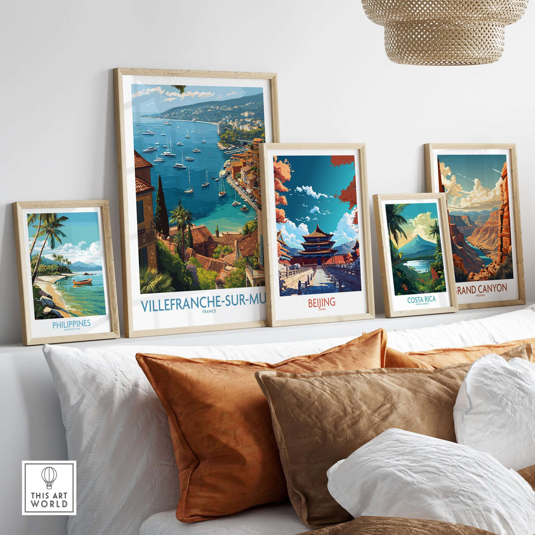 Collection of travel posters including Villefranche-sur-Mer, Beijing, and Costa Rica displayed in a stylish living room.
