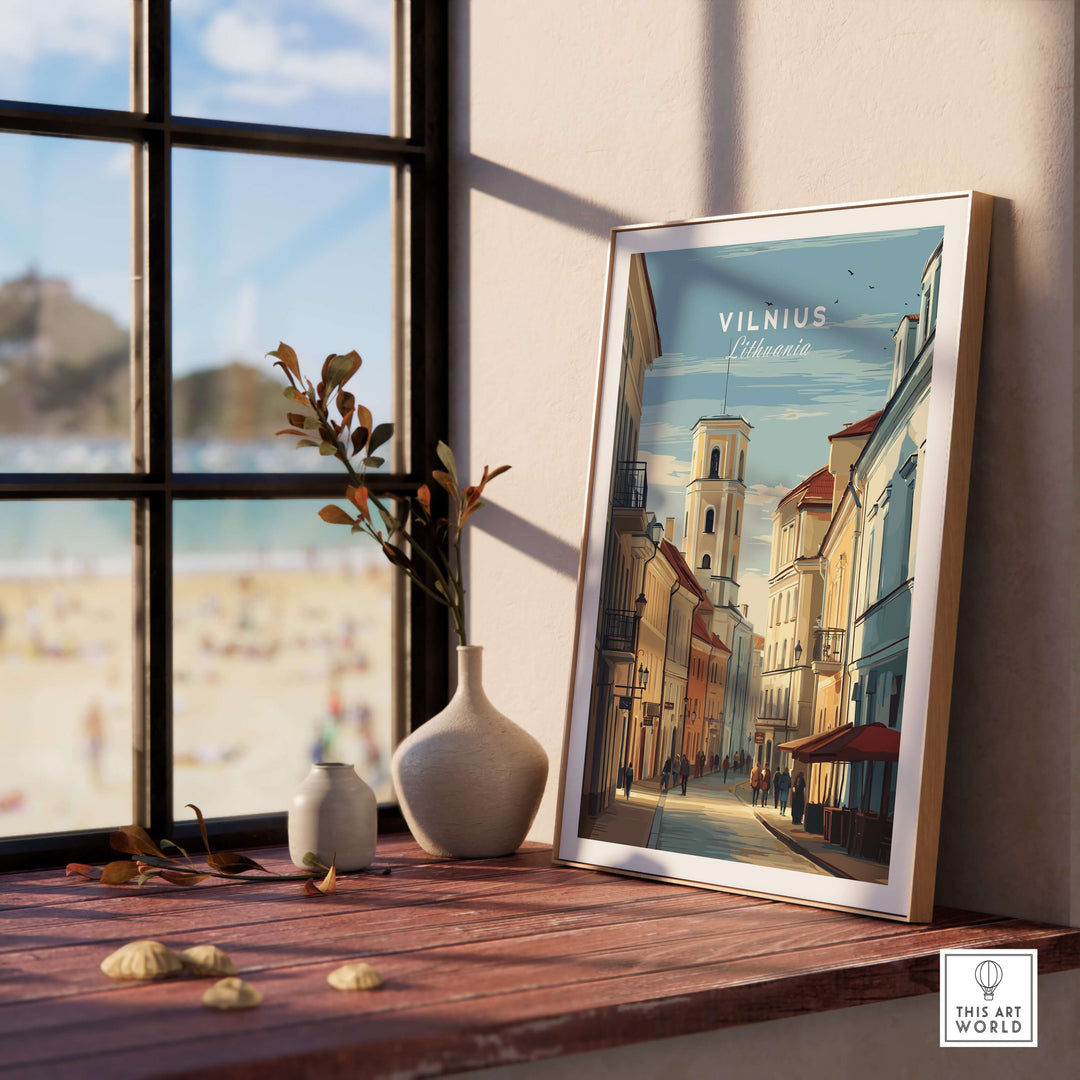 Vilnius travel poster depicting urban cityscape, framed on a sunlit shelf with vase and decor.