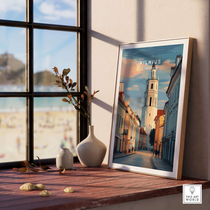 Vilnius poster featuring Lithuanian street scene, framed and displayed on a windowsill with decorative items.