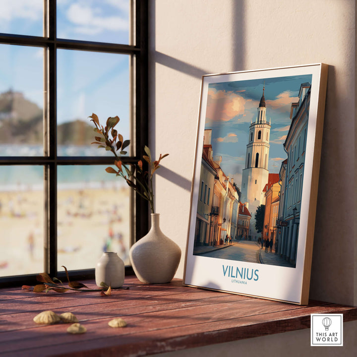 Vilnius Old Town poster showcasing Lithuania's architecture by a window, exuding charm and elegance in a cozy setting.