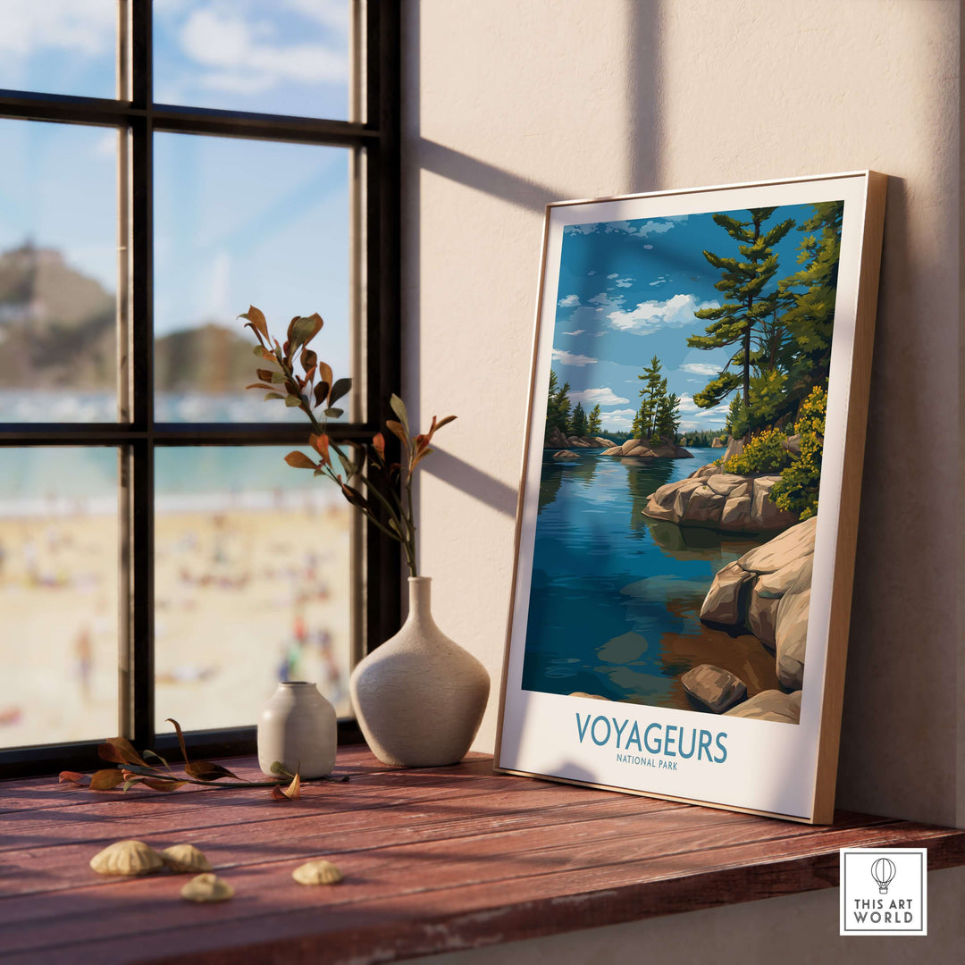 Voyageurs National Park Print | Minnesota Lake Islands Poster displayed on a wooden shelf by a window with a beach view.