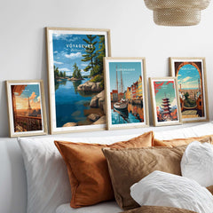 Voyageurs Poster | Nature Landscape Wall Art Print displayed with other framed travel posters in a cozy living room setting.