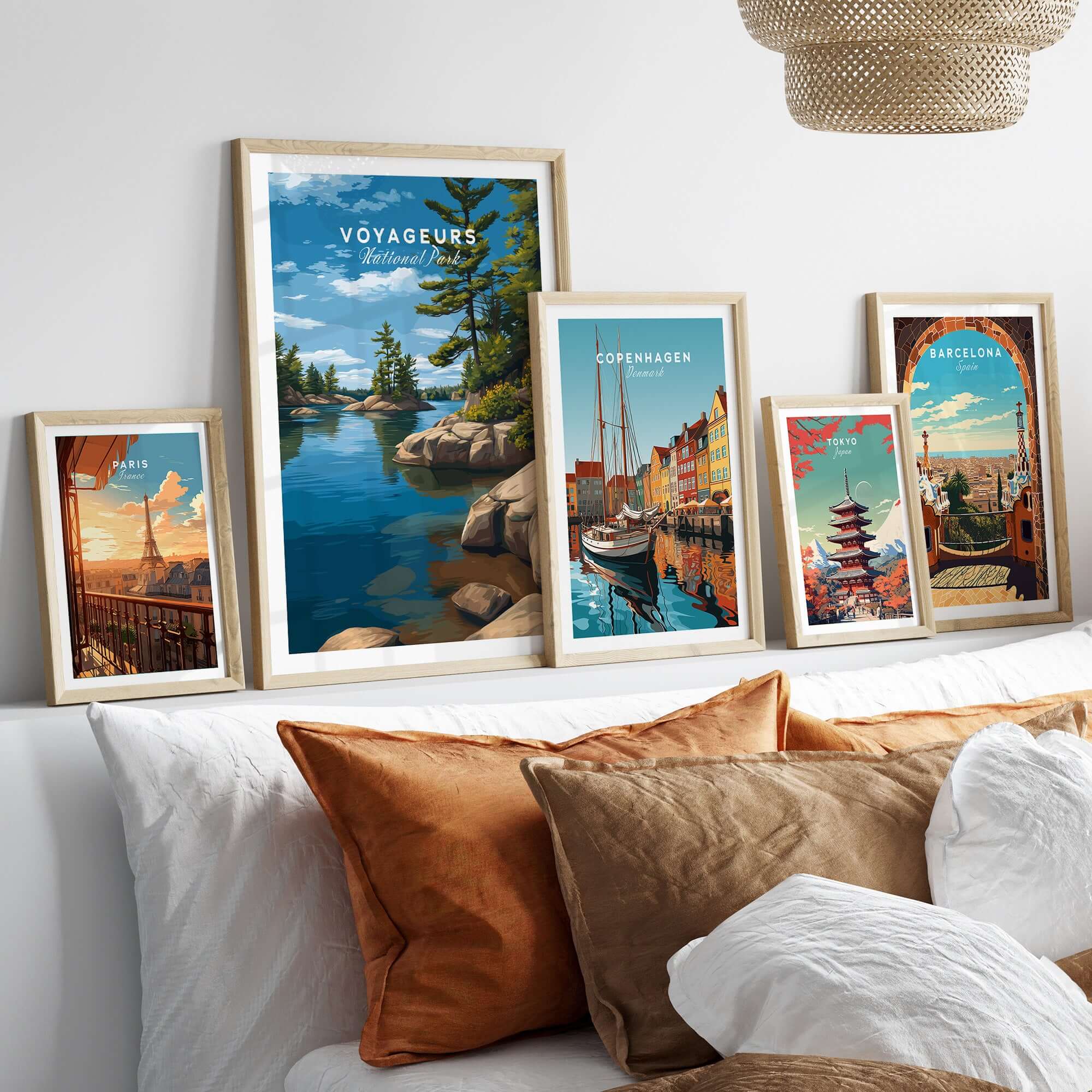 Voyageurs Poster | Nature Landscape Wall Art Print displayed with other framed travel posters in a cozy living room setting.