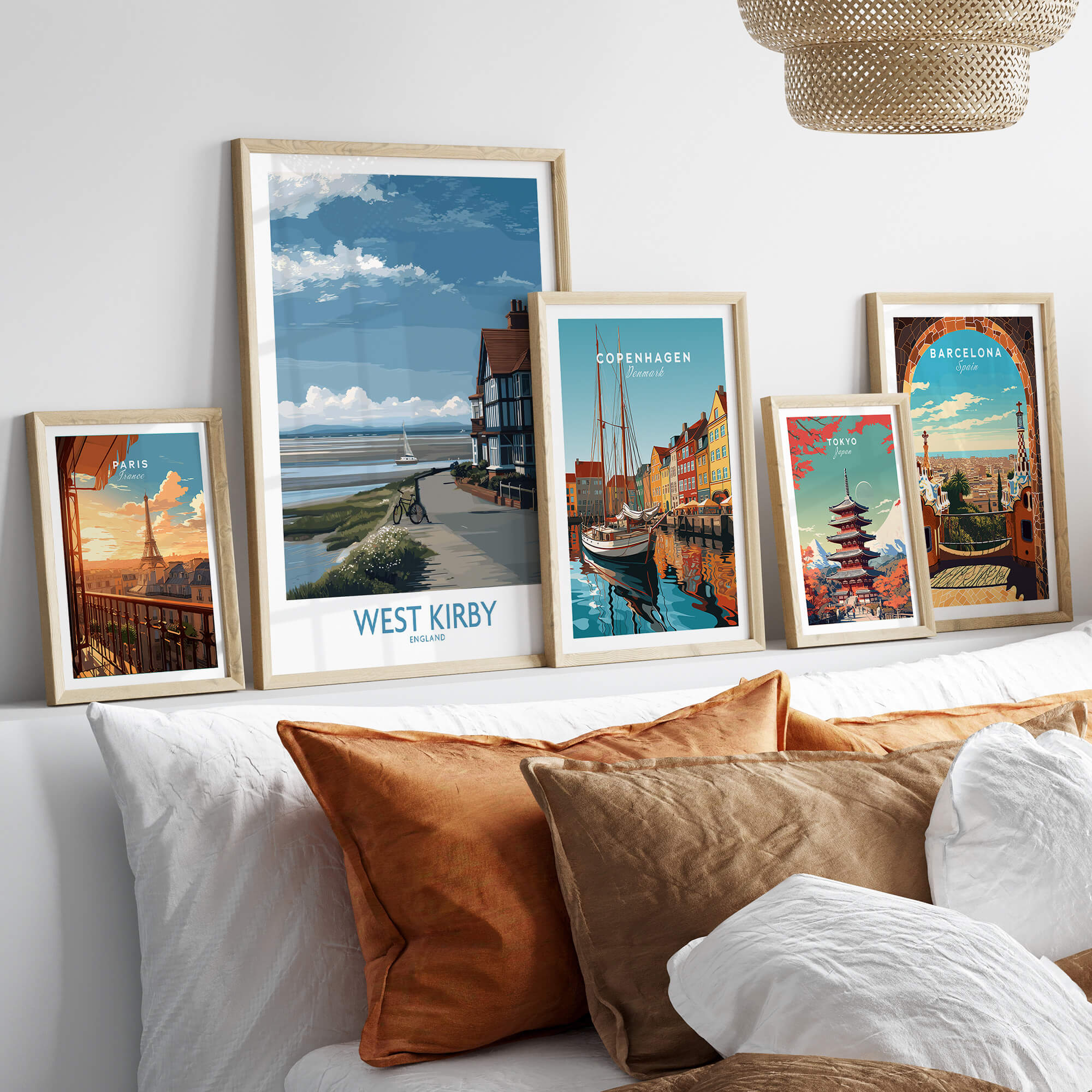 West Kirby Canvas Art Print displayed among other city art prints on a stylish shelf above a cozy sofa.