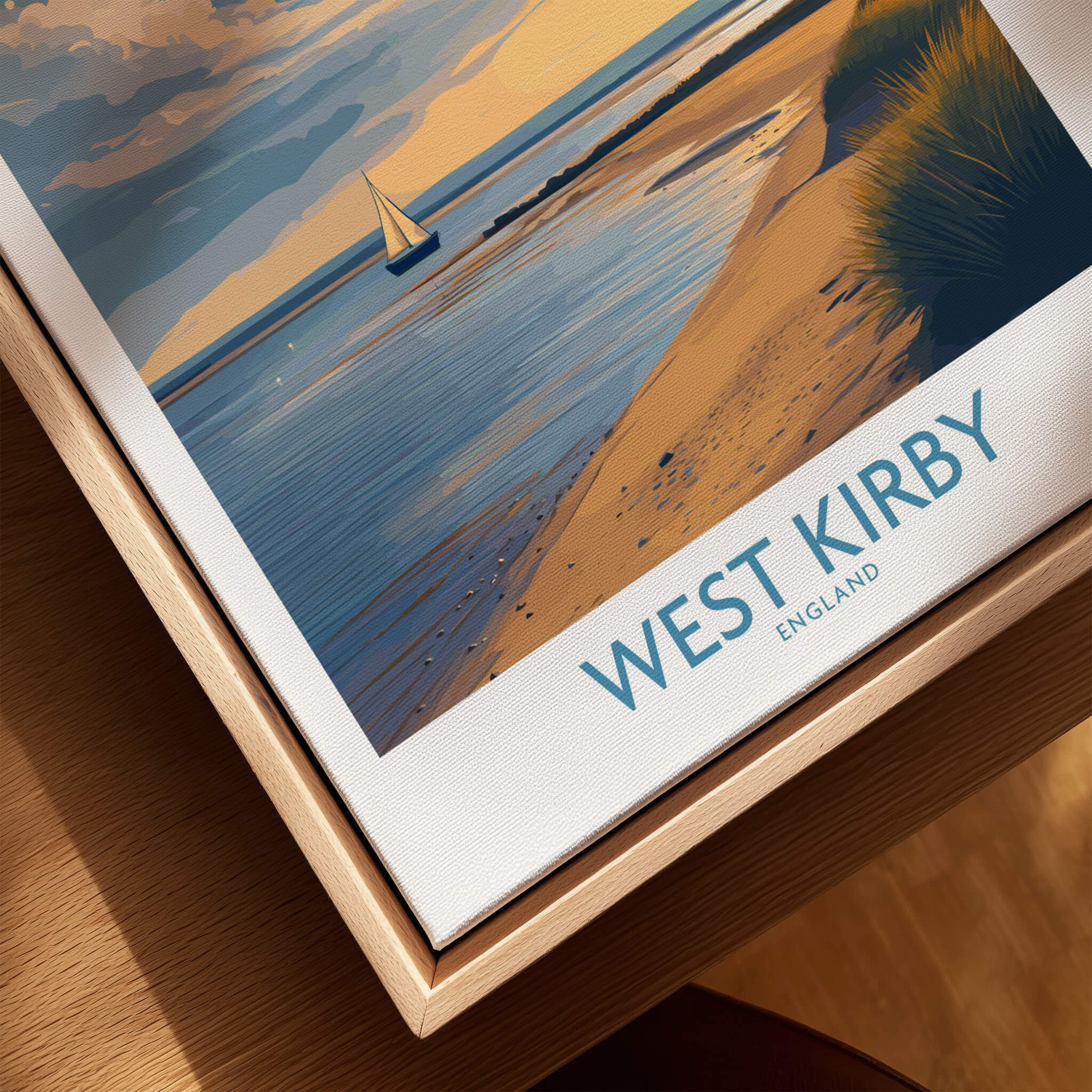 West Kirby England Canvas Print | Serene Coastline Sailboat Scene Poster displayed on a wooden surface.