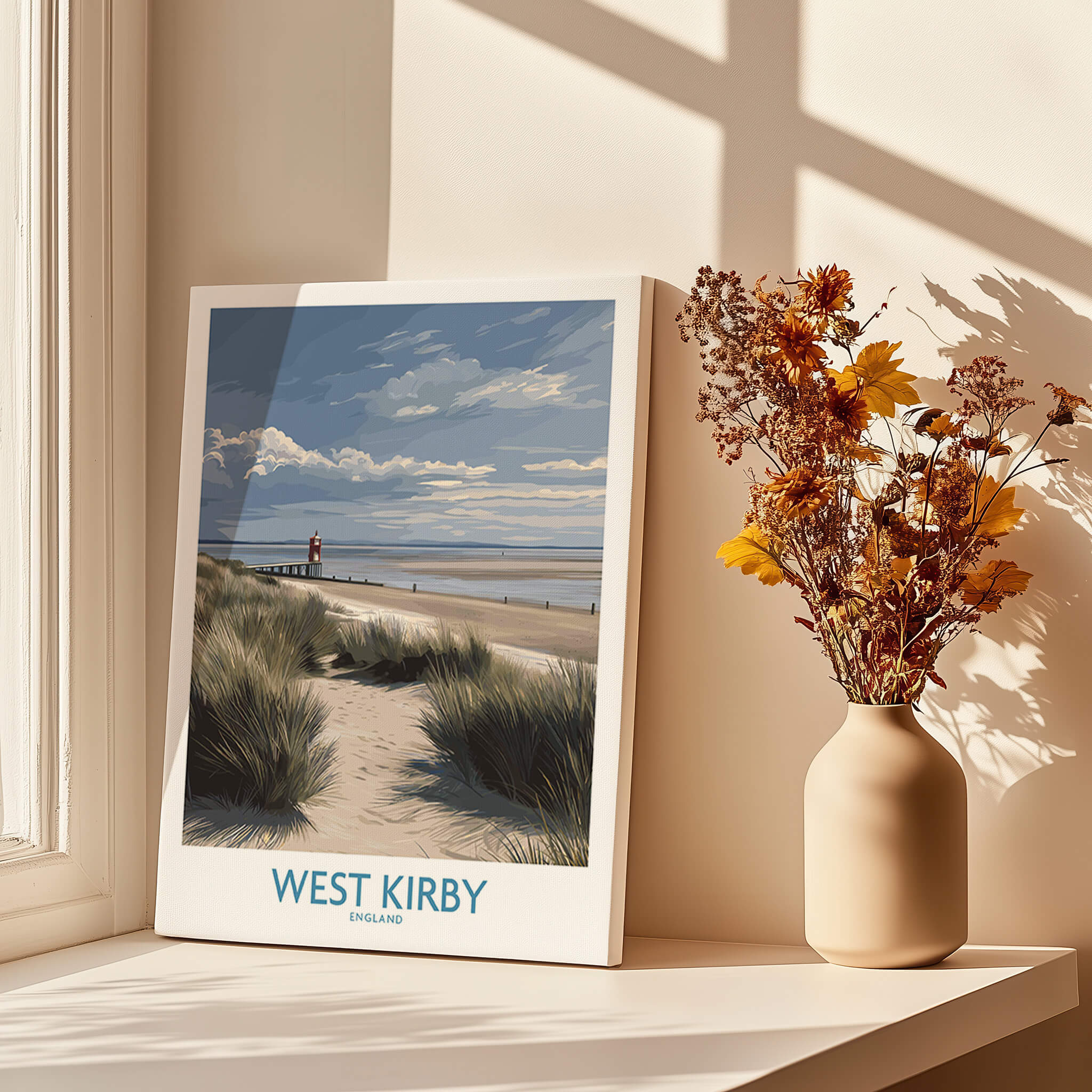 West Kirby England Poster | Coastal Sand Dunes Landscape Canvas Print displayed on a windowsill with flowers.